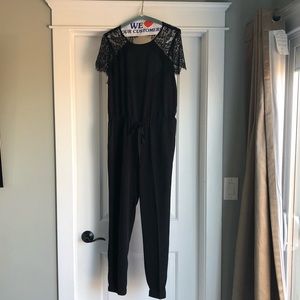 Black jumpsuit with lace capped sleeves